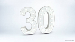 Large white "30" with embedded lights against a plain white background.