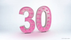 The image shows a large, illuminated number "30" with pink lights against a plain white background.