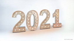 Illuminated marquee numbers displaying "2021" on a plain background.