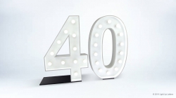 Illuminated marquee-style number "40" on a white background.