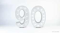 Illuminated numbers "90" with a white background.
