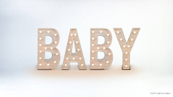 Illuminated marquee letters spelling "BABY" on a plain background.