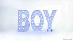 Illuminated letters spelling "BOY" with white lights on a plain background.