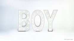 Illuminated letters spelling "BOY" on a plain background.