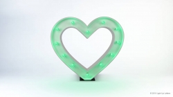 A heart-shaped light fixture with green bulbs is illuminated against a white background.