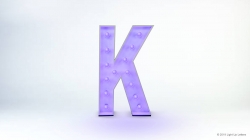 Large purple letter 'K' with lights on a white background.