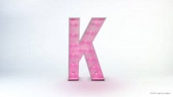 A pink marquee letter 'K' with lights against a light gray background.