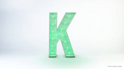 A large, illuminated letter "K" with a green glow against a plain white background.