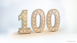 The image shows the number 100 in large, illuminated marquee-style numbers against a plain background.