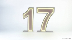 Illuminated number 17 with a neon glow on a white background.