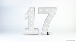 Illuminated marquee-style numbers "17" on a plain white background.
