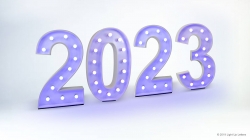 Illuminated marquee numbers displaying "2023" with a bluish glow on a white background.