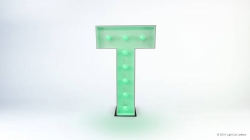A large, illuminated letter "T" in green lights on a white background.